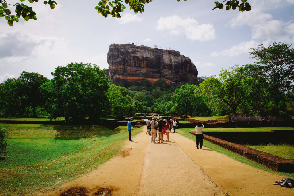 The ascent to the top of Sigiriya is an adventure in itself, with a series of staircases and walkways leading visitors through beautifully landscaped gardens, water gardens, and ancient frescoes.